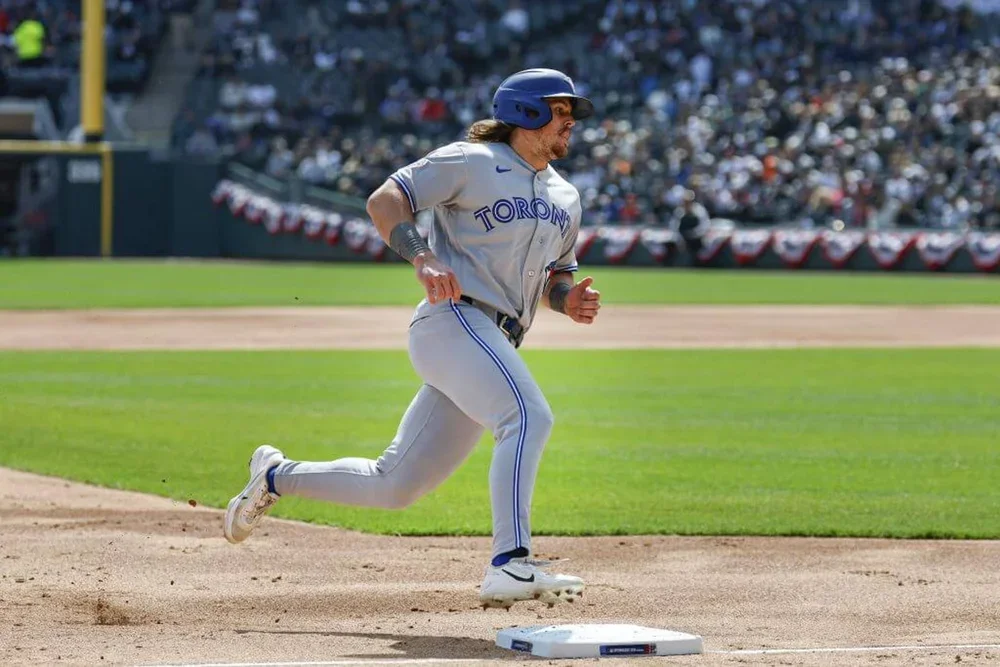 Toronto Blue Jays right fielder Addison Barger (47) runs to score against the Chicago White Sox during the second inning at Rate Field.