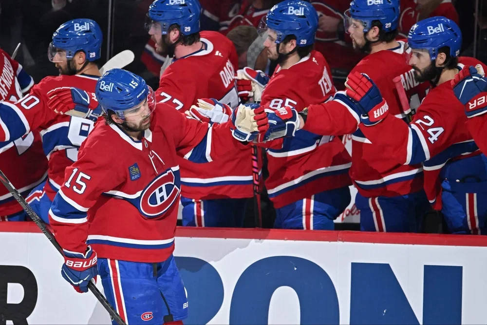 Montreal's Alex Newhook celebrates a playoff goal with teammates.